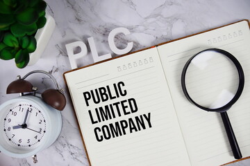 PLC - Public Limited Company acronym on notepad, Business concept background
