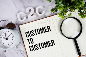C2C - Customer to Customer acronym on notepad, Business concept background