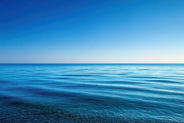 Obraz premium Tranquil ocean, vibrant blue sky