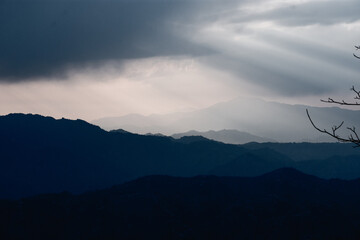 Moody Mountain Layers in Sunset