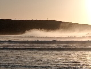 Sea fog at sunrise over the sea