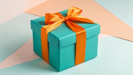 Obraz premium An eye-catching present in a striking teal hue, beautifully wrapped with a vivid orange satin bow, placed on a multi-toned pastel backdrop, ideal for illustrating contemporary design, joyful surprises