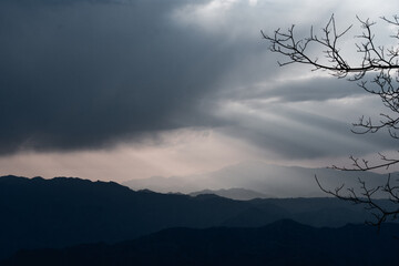 Dramatic Sky Over Layered Mountain Ranges