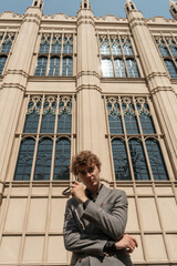 man in classic suit in the garden on the street