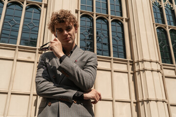 man in classic suit in the garden on the street
