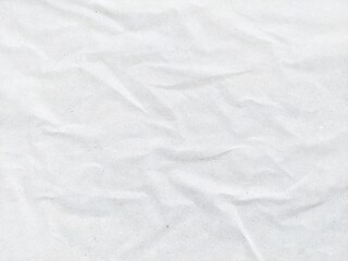 Wrinkled white paper texture background with wavy surface. Crumpled white vintage paper surface texture for background. Crumpled paper, abstract background. Paper background with copy space for text.