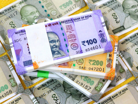 piles of new indian currency notes rupees 50,100,200 and 500