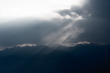 Sun Rays Breaking Through Clouds at Dusk