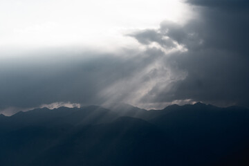 Sun Rays Breaking Through Clouds at Dusk