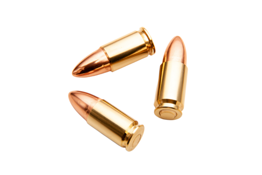 a group of bullet shells on a white surface