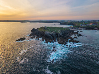 Stunning aerial drone landscape image of Towan Headland in Cornwall during beautiful vibrant Summer morning