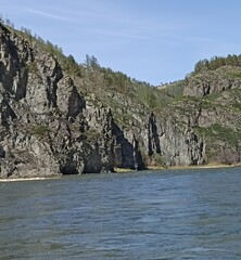Majestic Mountain Landscape with River, Rocks, and Lush Greenery, Perfect for Outdoor Adventures