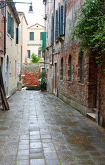 Fototapeta premium glimpse of a alley in Venice where all the streets are called CALLE