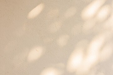close up on beige plain wall background texture with shadow of window from sunlight for ads and advertisement product such as cosmetic or content or goods design display concept