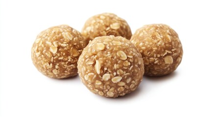Four oatmeal energy balls close-up on white background.