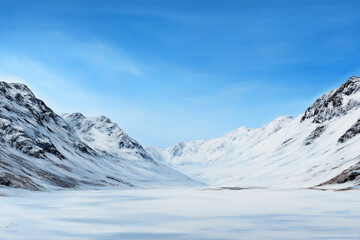 Snow-covered mountains under a clear blue sky in winter