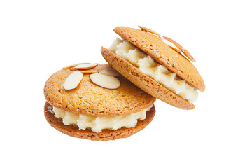 two cookies with almonds on top of them