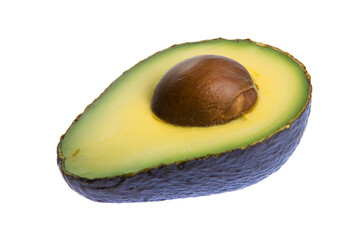 a half avocado with a seed on a white background