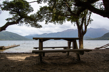 Lakeside Picnic Table Under Trees