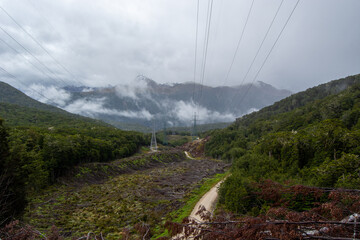 Scenic Mountain Landscape with Power Lines and Forest