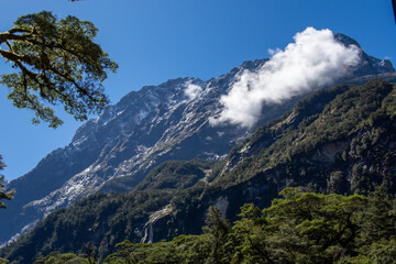 Majestic Mountain Landscape with Clouds and Greenery