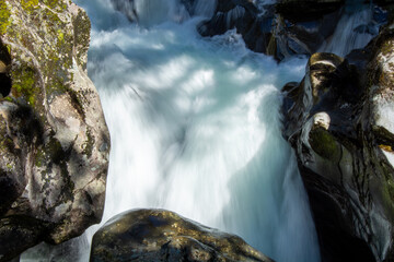Rushing Waterfall Over Dark Rocks