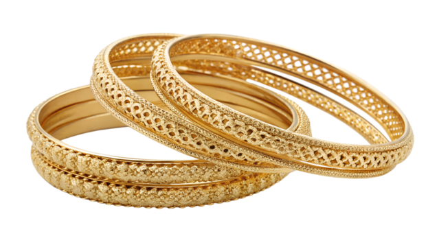 A stack of intricately designed gold bangles, isolated on a transparent background