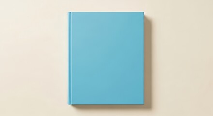 Fototapeta premium Minimalist light blue book cover template on a bright neutral background flat lay