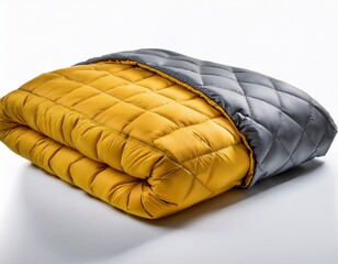 mustard yellow and gray quilted comforter isolated on white background