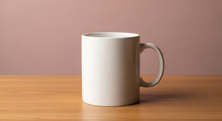 Obraz premium Simple elegant white ceramic coffee mug sitting on a wooden surface