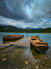 Wooden boats on a mountain lake, Black Lake, Durmitor, Montenegro