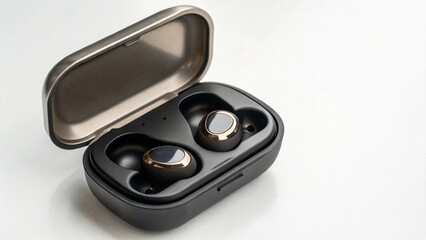 Wireless earbuds in charging case isolated on white background provide freedom and immersive sound...