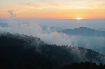 Fototapeta premium Golden Dawn Over the Mountainous Horizon
