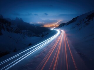 Winter highway with car light trails, snowy mountains and illuminated town