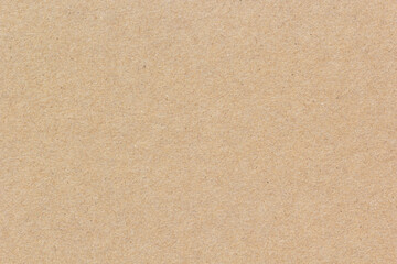 High-resolution brown recycled paper surface showing natural fiber texture, perfect for eco-friendly backgrounds, packaging, or craft design projects.
