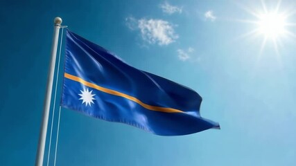 The flag of Nauru waves in the wind, celebrating Independence Day against a clear sky with bright sunlight illuminating the scene.