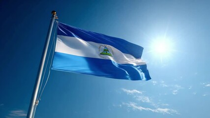 The flag of Nicaragua flutters proudly against a bright blue sky, symbolizing national pride during Independence Day festivities.