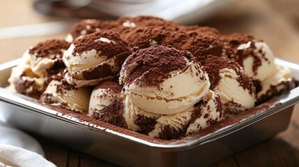 Creamy Tiramisu Gelato Topped with Cocoa Powder in a Silver Tray