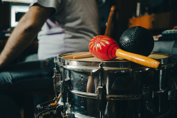 Shakers and sticks on a snare