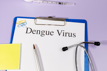 A Paper with “Dengue Virus” Title in Clipboard Set on the Desk with Stethoscope –...