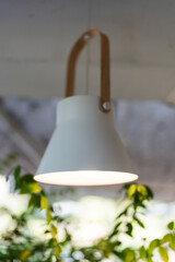 A white light fixture hanging from the ceiling