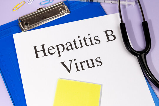 A Paper with &ldquo;Hepatitis B Virus&rdquo; Title in Clipboard Set on the Desk with Stethoscope &ndash; Viral Liver Infection Concept
