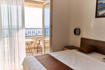 Serene ocean view from modern room with balcony and elegant decor | peaceful retreat