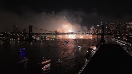Night drone view of Macy's Fourth of July fireworks celebration in New York