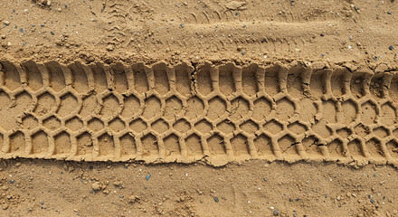 Honeycomb tread pattern pressed deep into dry desert sand texture detail ground surface