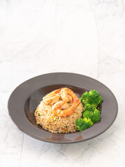 Homemade fired rice with shrimps and broccoli on white background, favorite menu in restaurant