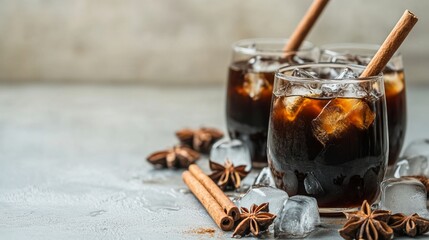 Refreshing Cold Brew Coffee with Ice and Cinnamon Sticks in Glasses