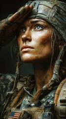 Strong female soldier saluting during military training with dirt and sweat in natural light outdoors