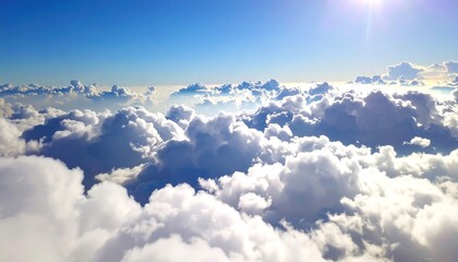 High-altitude view of puffy white clouds against a vibrant blue sky