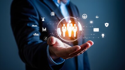 Businessman holding a glowing sphere with people icons and business symbols connected by lines